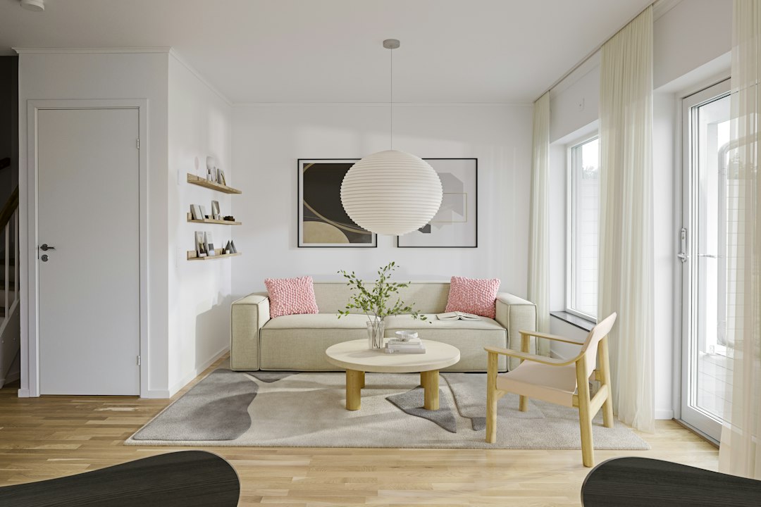 A bright, modern, and minimalist living room is shown with a floating price tag icon, symbolizing the financial mistake of incorrectly pricing a home for sale.