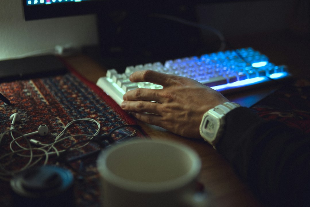 Person sits at a clean, modern desk with a calculator, papers, and house keys, looking concerned while planning the financ...